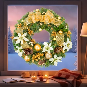 Luxurious Christmas wreath with gold pine cones and white flowers on a winter window