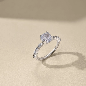 Macro shot of S925 silver ring featuring square zircon and marquise-cut side stones