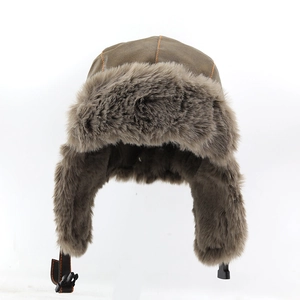 Detail of winter pilot hat featuring brown PU leather and thick faux fur lining with buckle