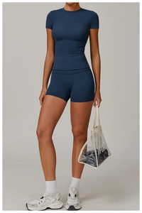 Detail view of quick-dry navy yoga set showing the seamless fabric and slim fit on model