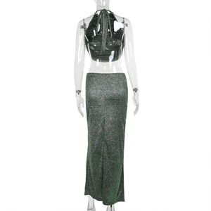 Detail of glittery emerald green halter top and high-waist maxi skirt back view