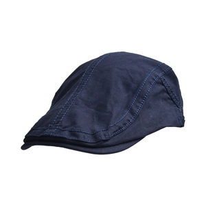 Detailed view of navy blue cotton twill flat cap with reinforced stitching craftsmanship