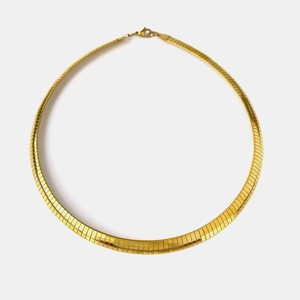 Flat 18K gold-plated snake bone necklace with polished metallic finish and lobster clasp