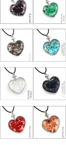 Detail view of heart-shaped crystal wish bottle pendants with various natural stone chips