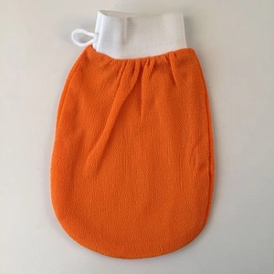 Exfoliating Moroccan bath glove in orange visocse fabric with elastic wrist cuff