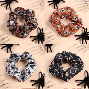 Set of 4 Halloween themed scrunchies with pumpkin ghost and spider web prints