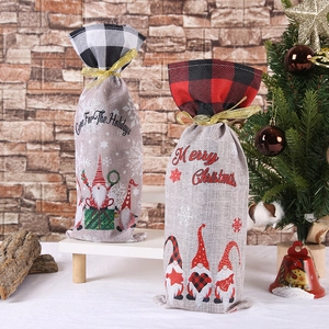 Christmas gnome wine bottle bags with plaid accents and festive holiday gift messages