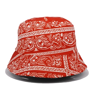 Detailed view of red bucket hat with white paisley pattern print on high-quality fabric