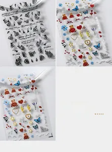 Detailed view of 3D minimalist nail art stickers with vintage floral and cute bear designs