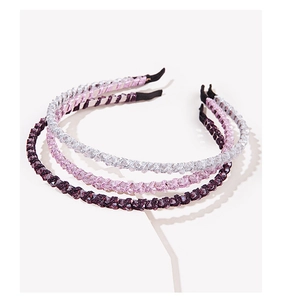 Detail view of purple, pink and white beaded hairbands with non-slip interior lining