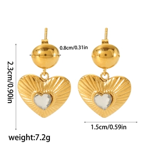 Vintage gold heart earrings set with sparkling stones and textured radial engraving