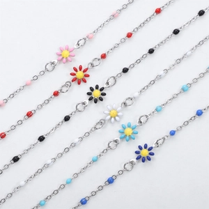 Daisy pendant bracelet set featuring colorful enamel flowers and metallic bead chains
