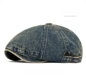 Detailed macro view of retro blue denim beret with brass adjustable buckle on the side
