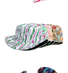 Detailed display of colorful patterned bucket hats featuring tie-dye and floral prints
