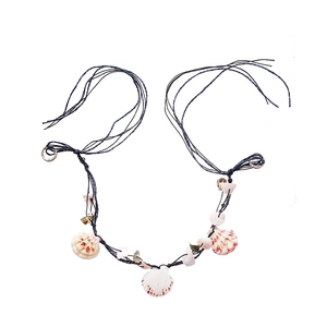 Summer raffia woven necklace with natural scallop shells and navy blue cords on white background