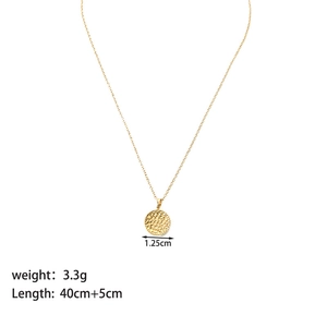 Detail of 1.25cm gold hammer textured star pendant necklace showing size and 40cm chain