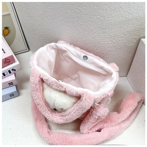 Pink plush crossbody bag with cute white bear decoration and interior magnetic clasp