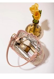 Internal view of the hollow bucket bag showing capacity for cosmetics and accessories