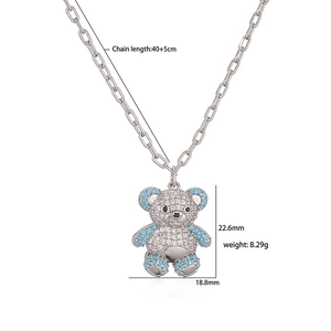 Silver bear pendant necklace set with sparkling blue and white cubic zirconia crystals