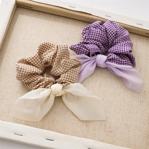 Sweet checkered fabric scrunchies with mesh bows in brown and purple colors