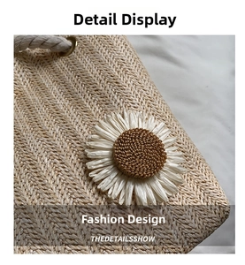 Close-up of woven straw handbag with a large 3D daisy flower and soft cotton rope handle