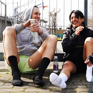 Close-up of thick athletic socks with cushioned soles on an outdoor basketball court