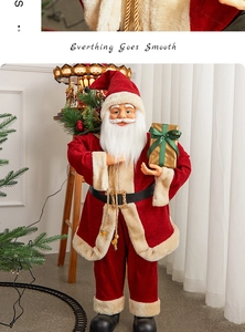 Detail of Santa Claus figure with red velvet suit, gold gift box, and green ribbon accent