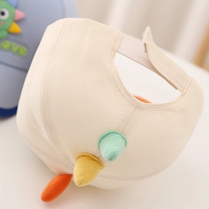 Detail of baby baseball cap with colorful dinosaur spikes and adjustable velcro strap