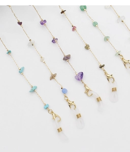 Close-up of assorted colorful natural stone bead eyeglass chains with gold metal links