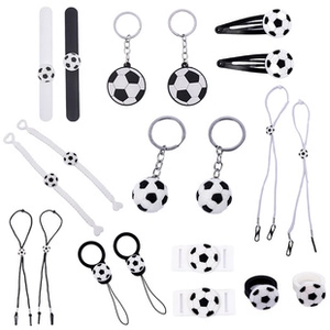 Flat lay showing details of the football accessories set with keychains and bracelets