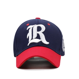 Detailed close-up of navy and red baseball cap with white 3D letter R embroidery