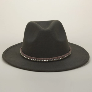 Close-up of the woven band with silver stud accents on a dark grey wool fedora hat