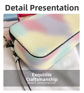 Close-up of rainbow gradient camera bag showing cross-grain texture and dark gunmetal hardware