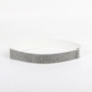 Detail view of white elastic waist belt with sparkling silver rhinestones for women