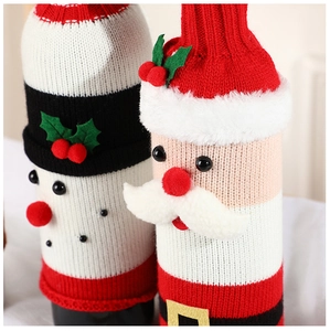 Detail of knitted Santa and Snowman wine bottle covers with plush textures and bead accents