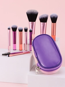 Detailed view of 10 mini makeup brushes with crystal handles and purple leather pouch