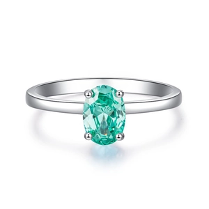 Elegante anillo de plata S925 con piedra ovalada verde azulado y engaste clásico de 4 garras