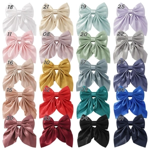 Grid display of 20 colors for oversized satin silk bow hair clips with numbered labels