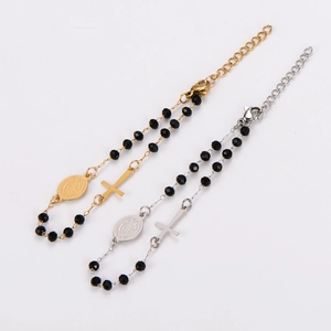 Religious rosary bracelet with black beads, cross pendant and Saint Mary medal charm