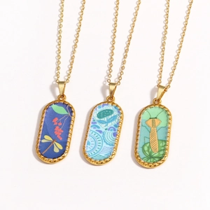 Three-piece 14k gold plated necklace set with colorful dragonfly and floral tarot pendants