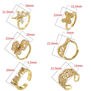 Lot de six bagues dorées géométriques papillon et fleur avec oxydes de zirconium