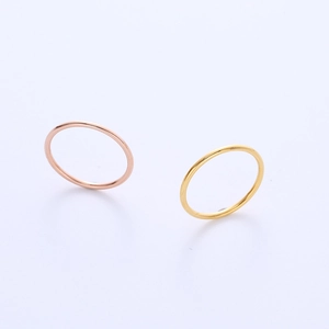 Minimalist titanium steel ring set in gold and rose gold finish with mirror polish
