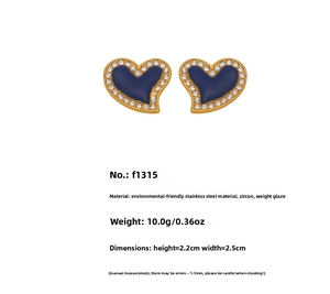 Macro detail of blue heart earrings with 18k gold plating and sparkling zircon border
