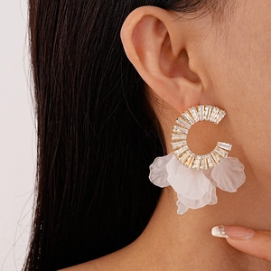 Chic gold C-shaped hoop earrings with zircon baguette accents and acrylic flower petals