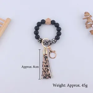 Leopard print silicone beaded keychain bracelet with faux leather tassel and gold ring