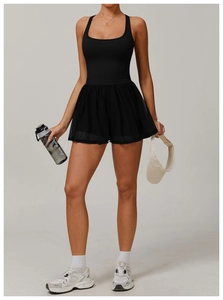 Detail of black sports tennis dress with breathable mesh skirt and criss-cross back straps