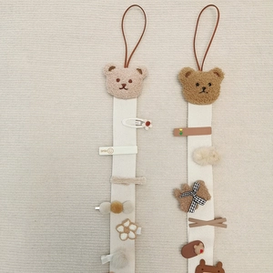 Hanging bear hair accessory organizer with canvas straps and plush clips for kids