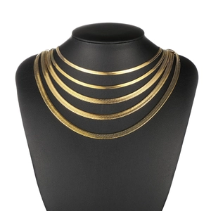 Five-layered golden stainless steel herringbone snake chain necklace for men on display