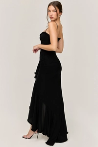 Side view of elegant black slim fit maxi dress with tiered ruffles and spaghetti straps