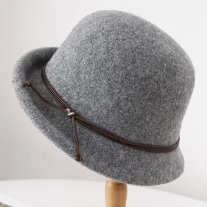 Deep grey wool cloche hat with brown leather cord and silver heart charm pendant